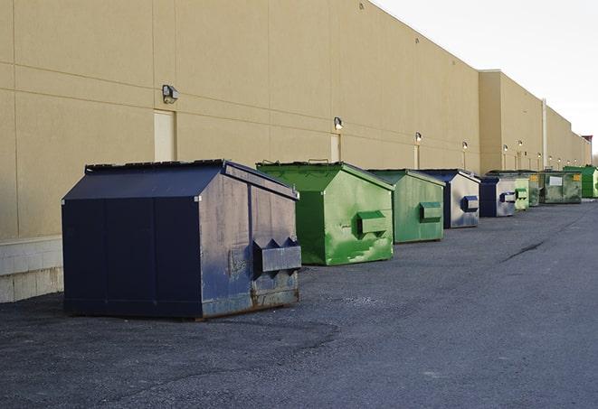 a fleet of red and blue construction dumpsters available for use in Cheshire OH